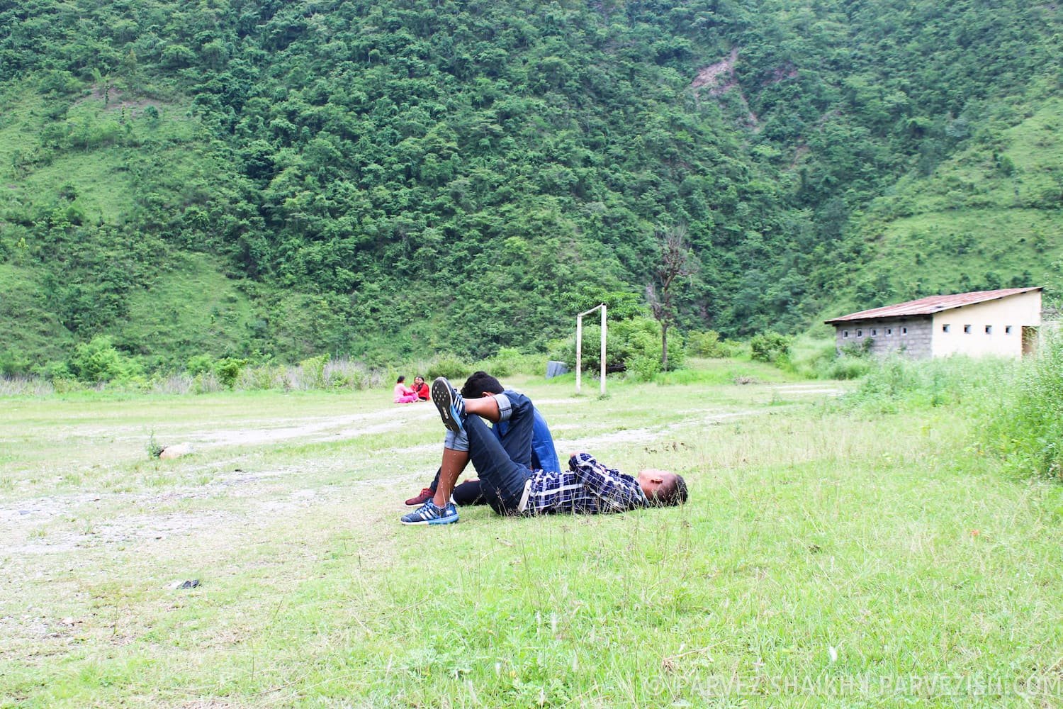 Passengers relaxing on grass