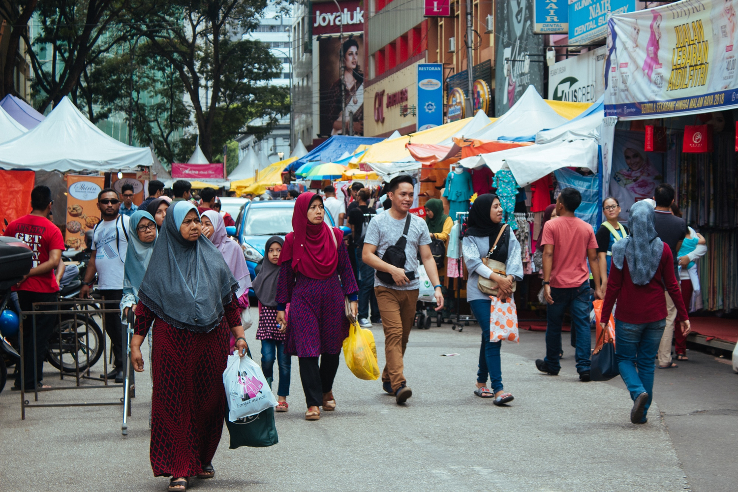 People in Kuala Lumpur shopping for Eid - known as Hari Raya in Malaysia