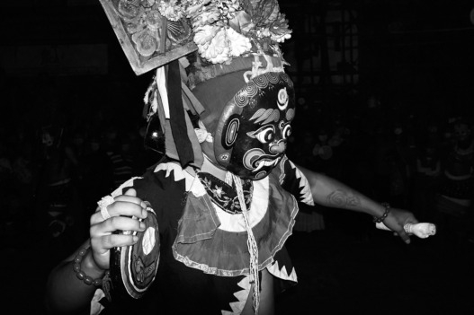 A masked man performs a dance during Indra Jatra celebrations in Kathmandu, Nepal