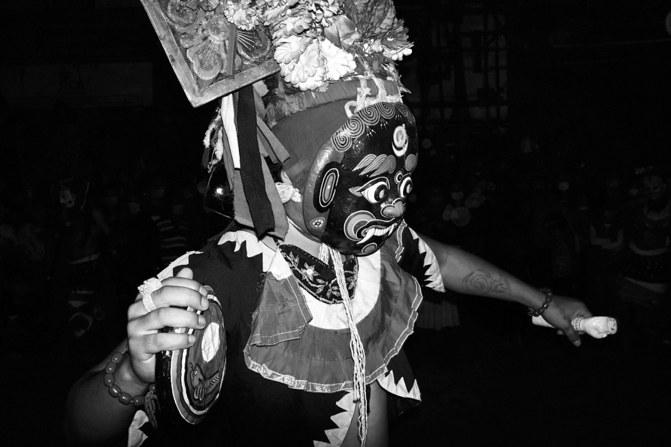 A masked man performs a dance during Indra Jatra celebrations in Kathmandu, Nepal