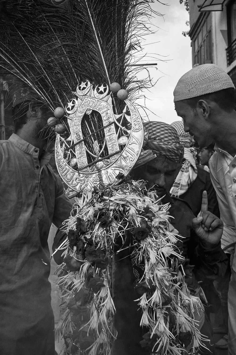 During a tazia procession. Ahmedabad, India. 2023