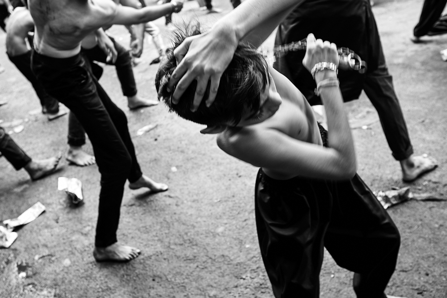 A young boy engages in self-flagellation during Ashura/Muharram. Ahmedabad, India. 2024